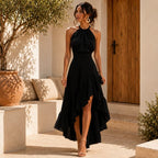Elegante vestido de invitada de boda con cuello halter y bajo asimétrico de volantes